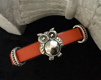 Orange leather bracelet with a spends leather OWL