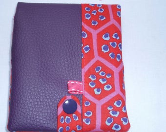 Notebook 8.5 cm by 12 cm, with its purple leatherette cover
