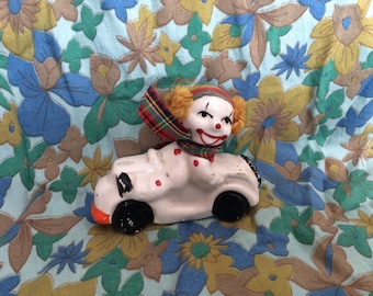 Vintage Retro Kitsch Scary Clown Ornament on a Motorbike / Car