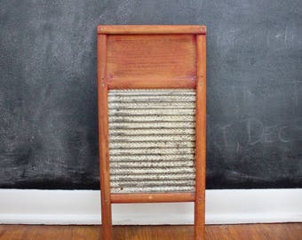 Small vintage washboard with metal surface by the Columbus Washboard Company