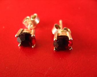 Ornate pair of buttons of ears of a Garnet