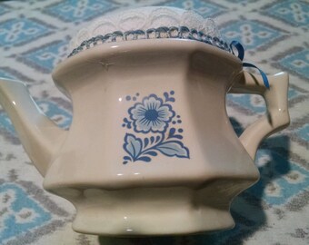 pincusion made from collectible avon teapot candleholder