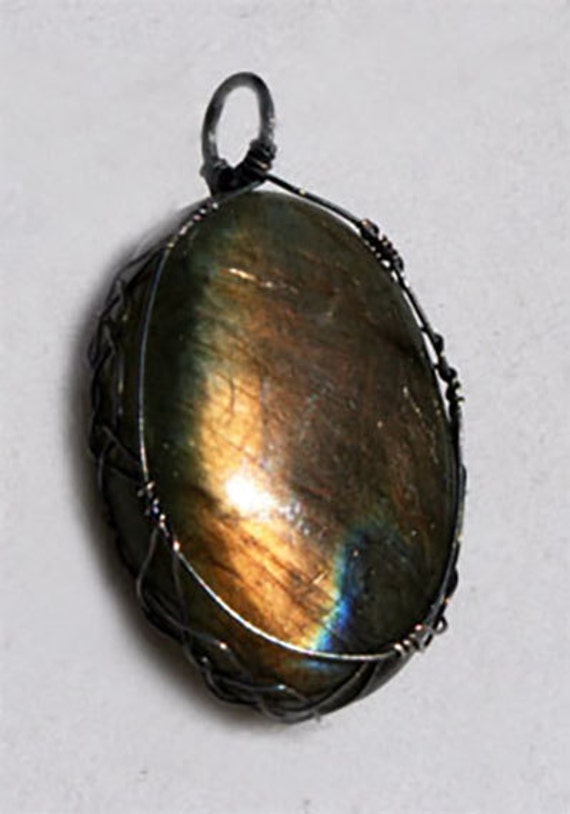Labradorite pendant wrapped Celtic style with oxidized sterling silver