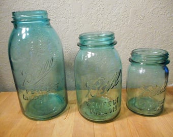 Set of three blue ball jars; 1/2 gallon, quart, pint;1910-1933