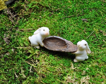 Two Rabbits Carrying Nut Shell