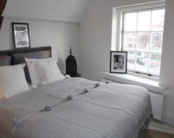 Moroccan pom pom blanket grey