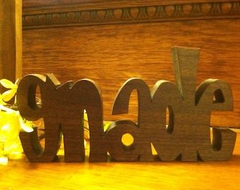 Inspirational wooden words "GNADE" (German word for Grace)