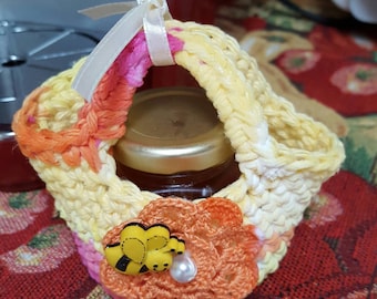 Crochet honey or jam holder.