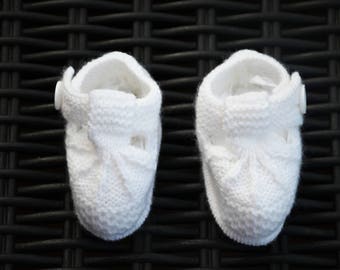 White baby booties in size 3 months