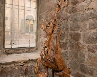 An Abstract Handcrafted Guitar Sculpture, Made of Old Olive Wood from the Holy Land