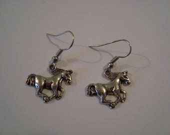 Silver metal galloping horse earrings