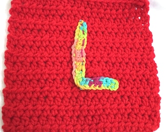 Crocheted washcloth with letter
