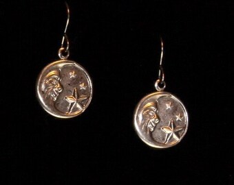 Man in moon earrings on hypoallergenic surgical steel ear wires