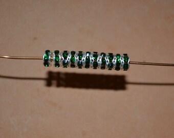 5.2mm Silver Plated rondel spacer beads with Emerald Rhinestones (2040523)