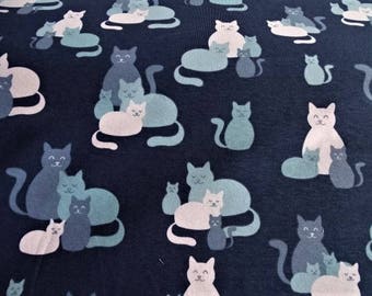 Fabric cotton jersey printed with "cats" design on blue background