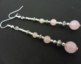 A pair of pretty pink jade bead silver plated long dangly earrings.