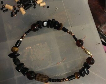 Black beaded tigers eye protection bracelet
