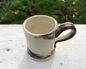 Handmade pottery mug, brown and white