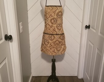 Bib style apron. Made very durable to last. Great for when cooking, baking, or grilling.