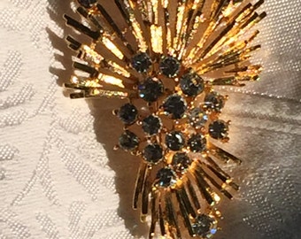 M.Jent Gold Tone burst brooch with clear rhinestones