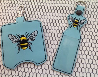 Hand sanitiser and lip balm holders set.