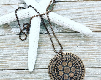 Copper medallion pendant on 23" copper ball chain.