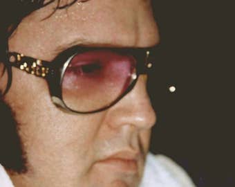Elvis Presley , Elvis in his limo after a show.