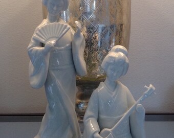 Two blanc de chine style geisha statues