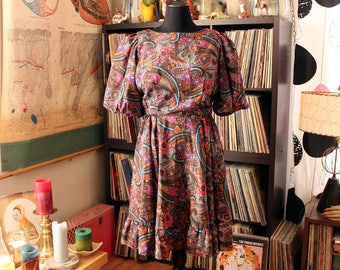 vintage 1980s square dance dress by Jorrino, wild paisley print with circle skirt and puffed sleeves