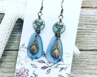 Mint green biddie beads wire wrapped with blue faux sea glass and vintage bronze charm.