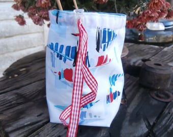 Little sock knitting bag with watercolor sailboats.