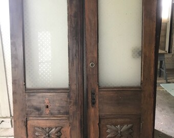Antique double doors with etched glass and matching etched transom.