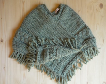 Poncho with fringe daughter (4t). Olive green