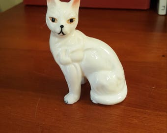 Vintage white cat figurine.