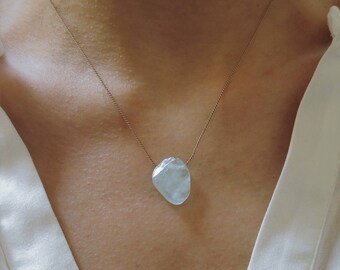 Raw aquamarine necklace. Rough icy blue aquamarine necklace on a brown silk thread. Rough slice aquamarine necklace. March Birthstone.
