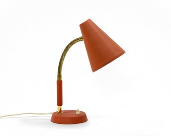 Vintage 1950s gooseneck table lamp with matte red lacquer. Good working condition but with a few marks and scratches of time. Swedish made.