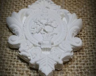 Finely crafted in raw cast Medallion