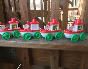 Set of 4 Plastic Santa in Tugboat Christmas Ornaments Hong Kong