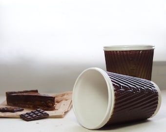 Coffee cup or ceramic travel mug. Porcelain cup in chocolate brown and white. Ceramic travel cup for use as a tea cup or coffee cup. .