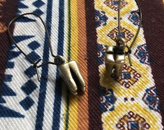Human tooth necklace