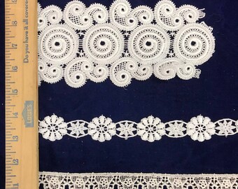 1 Yard of a white lace braids , lace trim