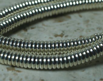 Silver tone rondelle beads aprox 6mm in diameter 2mm thick hole size aprox 1mm, 50 pcs (item ID FA2467MB)