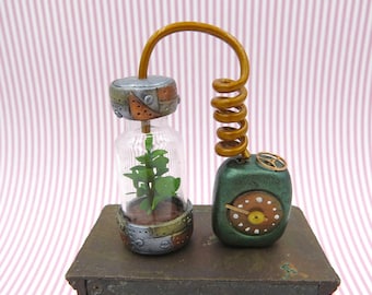 Steampunk hydroponic with power unit and faux brass hose in 1:12 scale