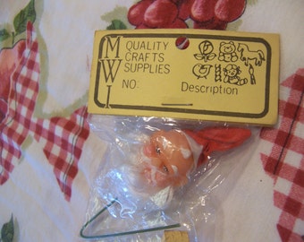 tiny rubber santa head