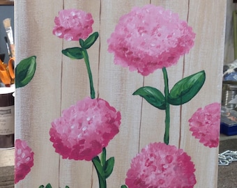 Pink hydrangea on a fence