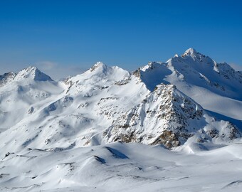 Snowy winter in the Caucasus mountains on a sunny day