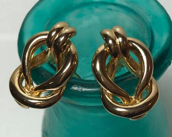 Vintage gold tone clip on Gay Boyer earrings