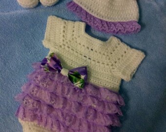 Crochet white romper with lavender lace ruffles, comes with hat and shoes.