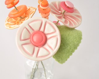 pink and orange button flower bottle bouquet