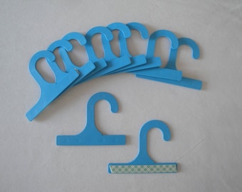 Plastic hangers with adhesive pad